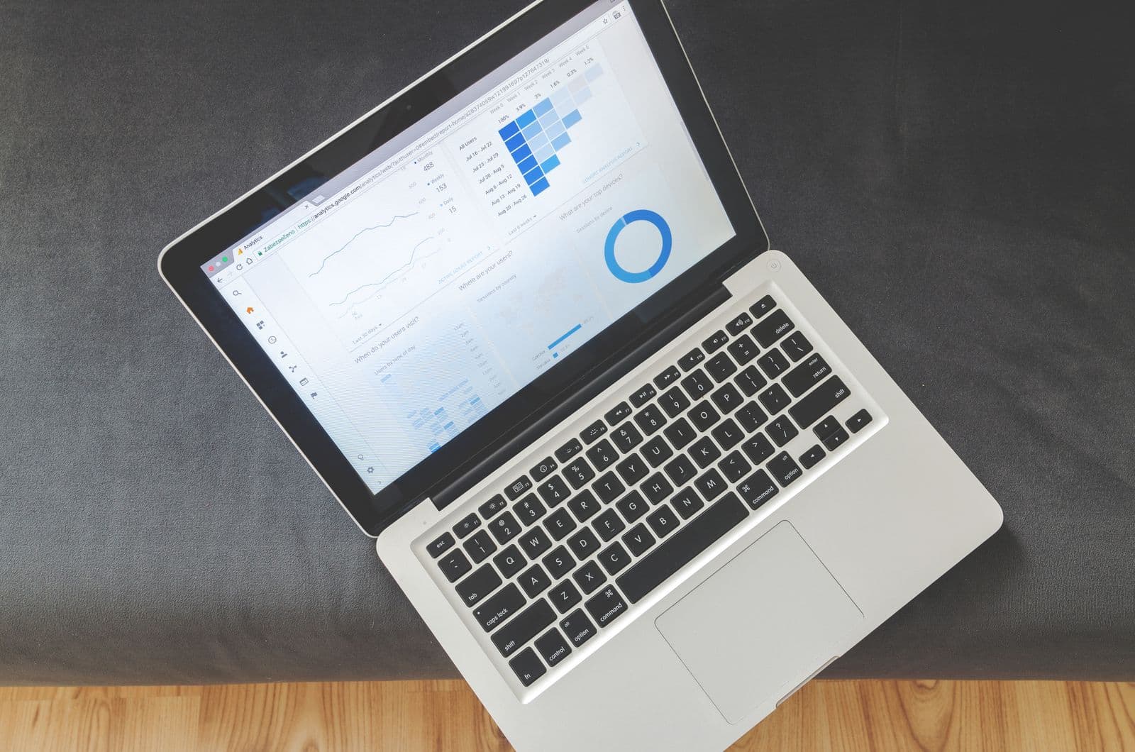Laptop screen with a code editor open on a dark desk, representing event software comparison