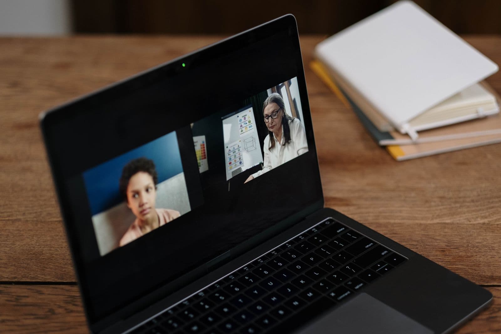 Laptop set up for a video call during a hybrid event meeting